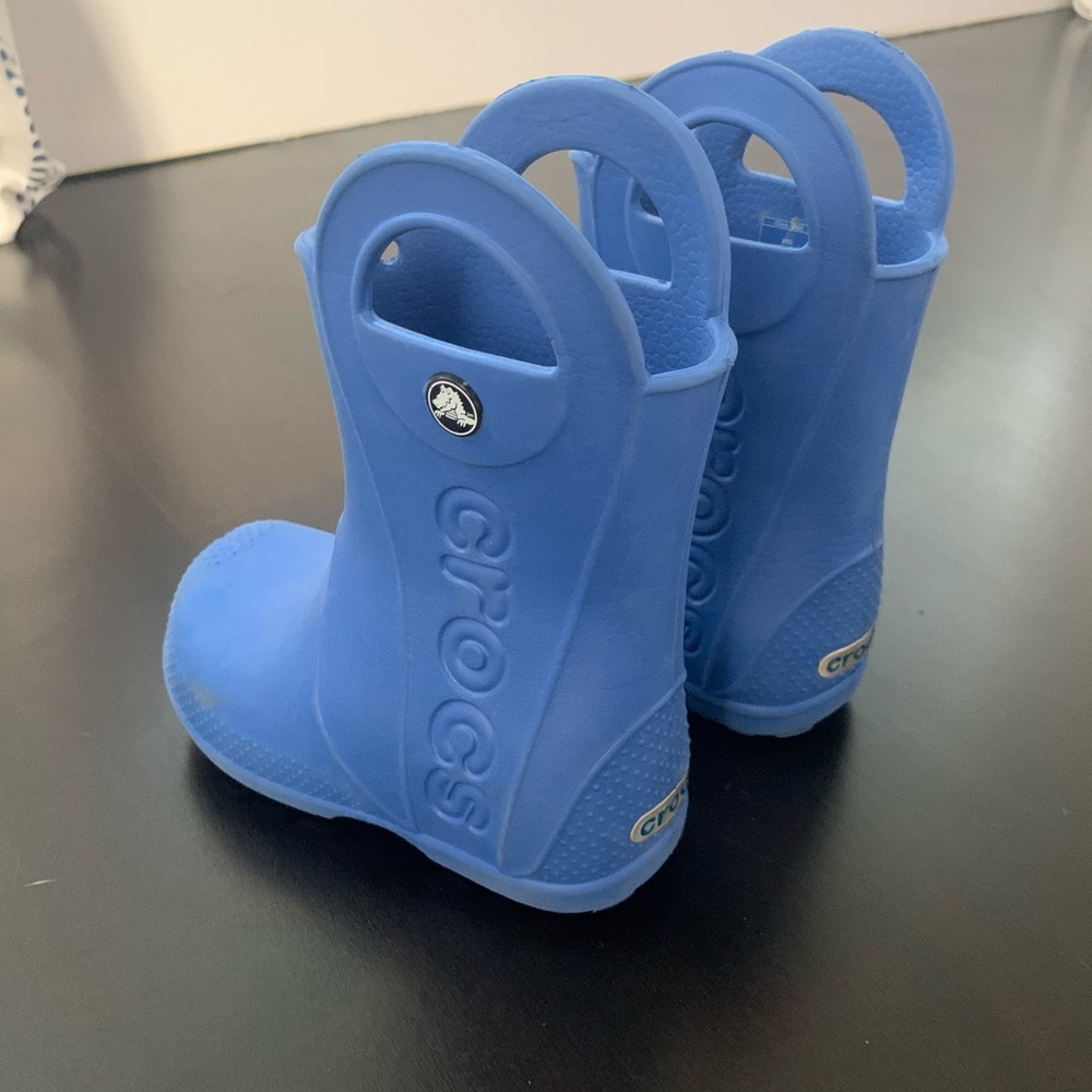Blue Crocs rain boots